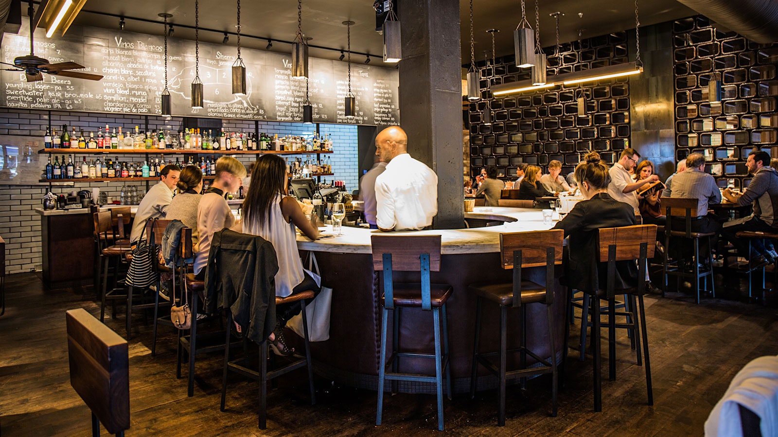 Guests around the bar at Barcelona Wine Bar’s Inman Park location in Atlanta